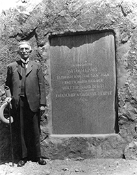 Otto posing by his honorary tablet at Bear
Creek Falls where his famous toll gate/house was during the dedication
in 1929 or 1931